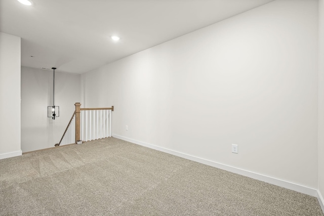 carpeted spare room with recessed lighting and baseboards