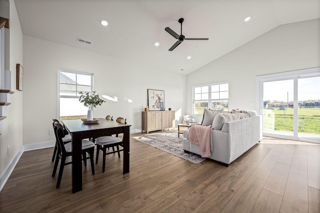 living area with recessed lighting, dark wood-style flooring, high vaulted ceiling, a ceiling fan, and visible vents