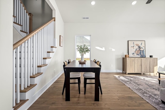 dining area featuring dark wood finished floors, visible vents, stairs, and recessed lighting