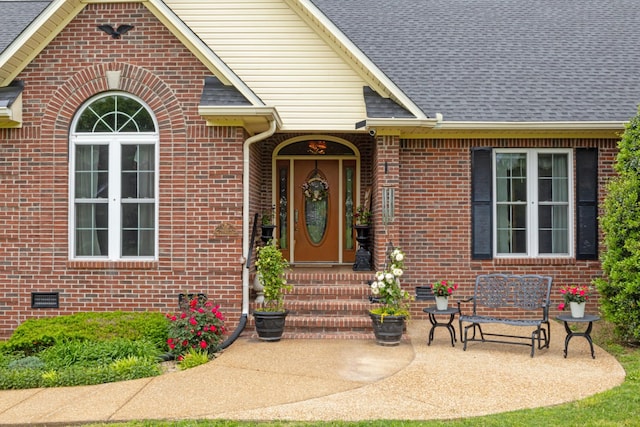 3668 Stonecreek Dr, Spring Hill, TN 37174 - doorway to property with brick siding, a patio area, and roof with shingles