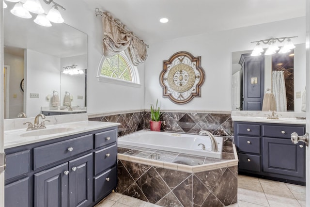 3668 Stonecreek Dr, Spring Hill, TN 37174 - full bath with a garden tub, a sink, tile patterned floors, and two vanities