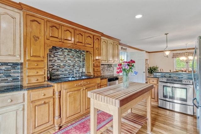3668 Stonecreek Dr, Spring Hill, TN 37174 - kitchen with dark stone counters, a chandelier, a sink, backsplash, and stainless steel appliances