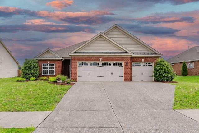 494 Callie Ave, Gallatin, TN 37066 - craftsman house featuring a front yard, driveway, an attached garage, and brick siding