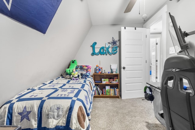carpeted bedroom featuring a ceiling fan and vaulted ceiling