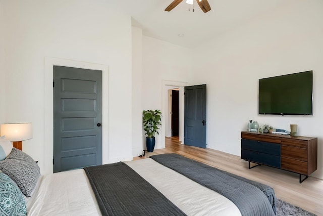 bedroom featuring a ceiling fan and light wood finished floors