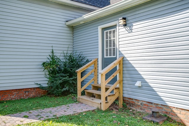 view of exterior entry with crawl space