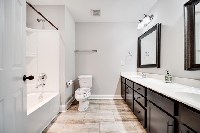 230 Fowler Cir, Franklin, TN 37064 - full bathroom with toilet, baseboards, visible vents, a sink, and double vanity