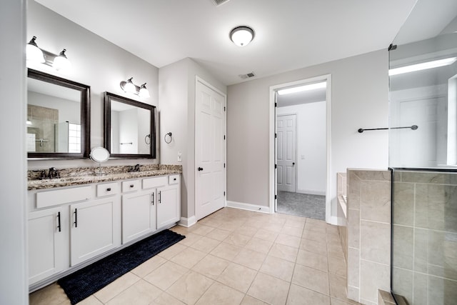 230 Fowler Cir, Franklin, TN 37064 - full bath featuring visible vents, tile patterned flooring, double vanity, a garden tub, and a tile shower