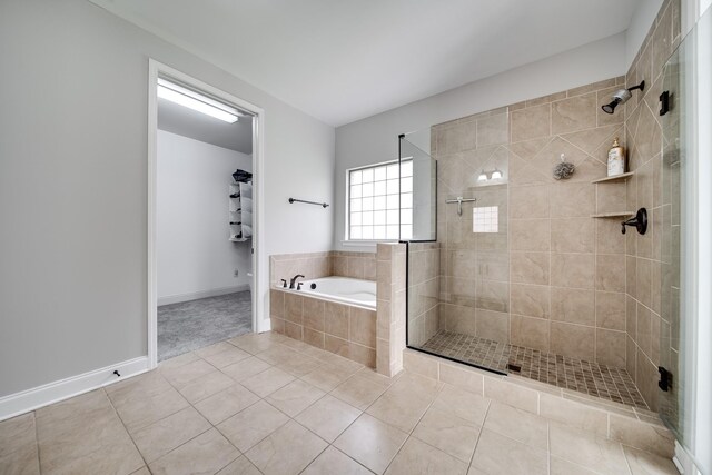 230 Fowler Cir, Franklin, TN 37064 - full bath with tile patterned flooring, a garden tub, a shower stall, and baseboards