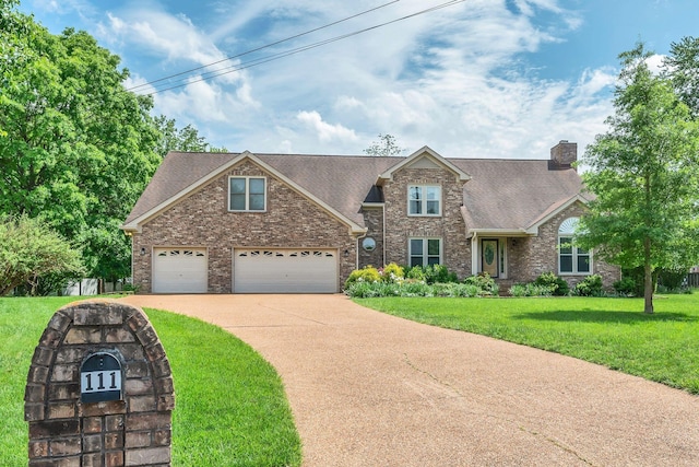 traditional-style home with a front yard, a chimney, brick siding, a shingled roof, and concrete driveway