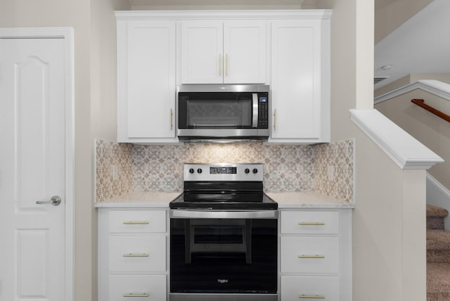 184 Whitman Aly, Clarksville, TN 37043 - kitchen featuring white cabinetry, stainless steel appliances, and backsplash