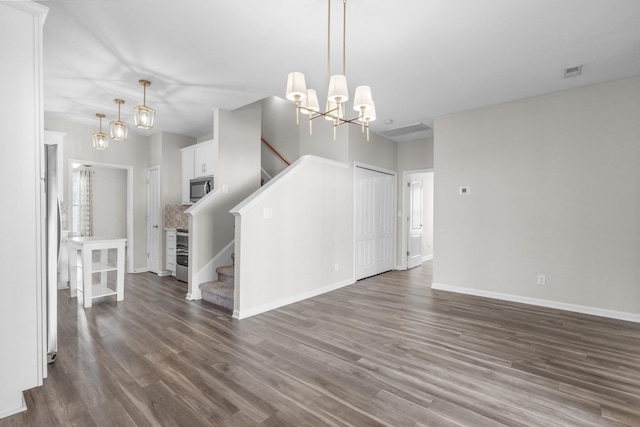184 Whitman Aly, Clarksville, TN 37043 - unfurnished living room featuring a chandelier, baseboards, stairs, and dark wood-type flooring