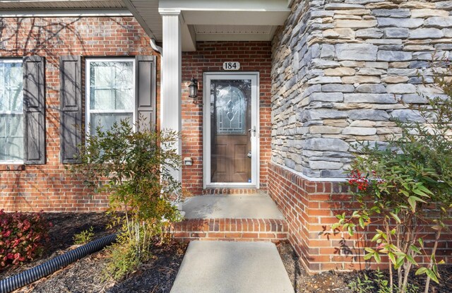 184 Whitman Aly, Clarksville, TN 37043 - doorway to property featuring brick siding