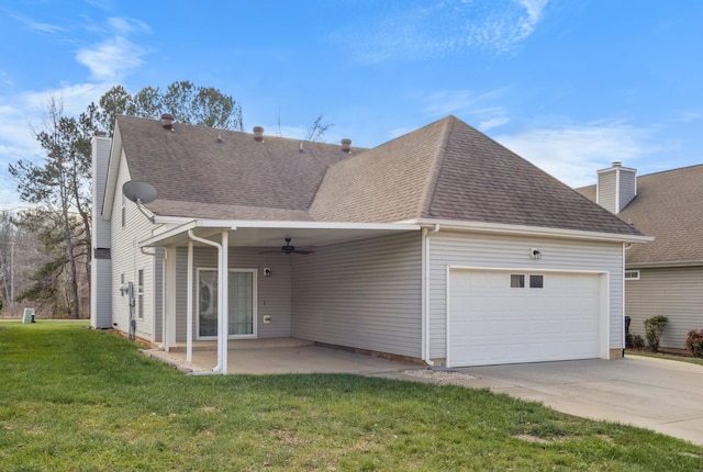 184 Whitman Aly, Clarksville, TN 37043 - rear view of property featuring a chimney, ceiling fan, a yard, and an attached garage