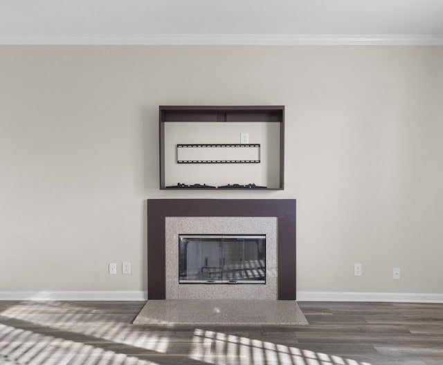 184 Whitman Aly, Clarksville, TN 37043 - room details featuring baseboards, wood finished floors, ornamental molding, and a glass covered fireplace