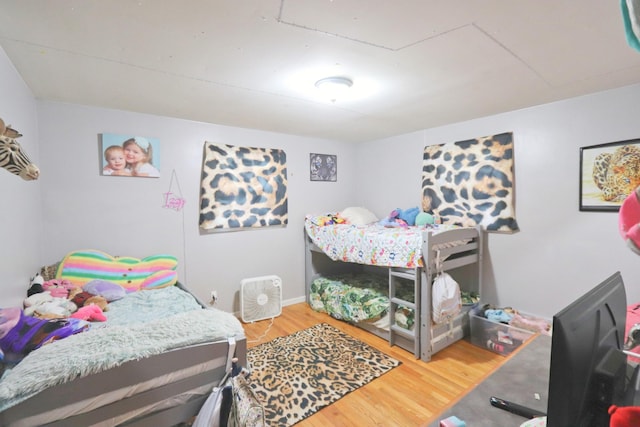 bedroom featuring wood finished floors
