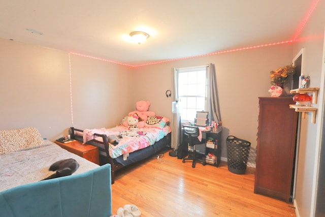 bedroom with light wood-type flooring
