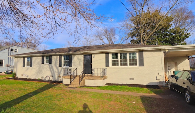 ranch-style home featuring a shingled roof, brick siding, a front lawn, and crawl space