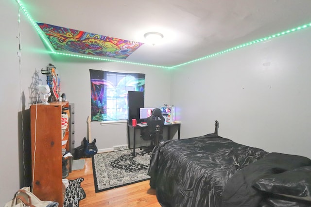 bedroom featuring wood finished floors