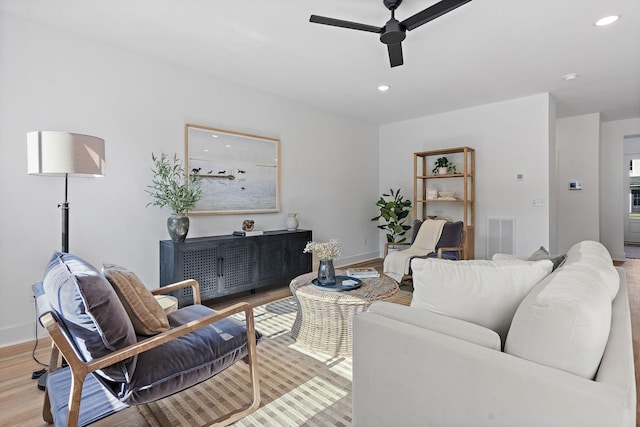 living area featuring light wood finished floors, recessed lighting, visible vents, and ceiling fan