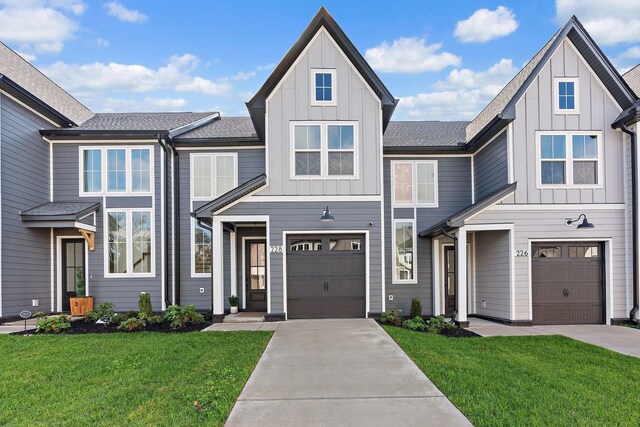 multi unit property with driveway, board and batten siding, and an attached garage