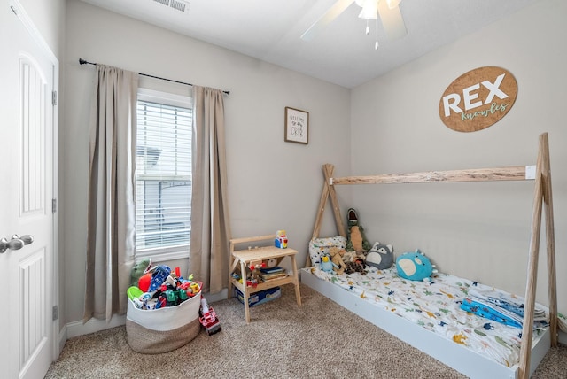 bedroom with visible vents, carpet flooring, baseboards, and a ceiling fan