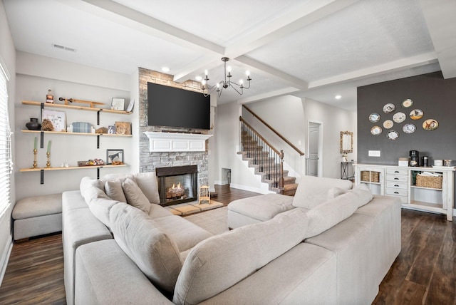 living room featuring recessed lighting, dark wood finished floors, and a stone fireplace