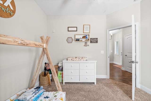 bedroom with baseboards and carpet flooring