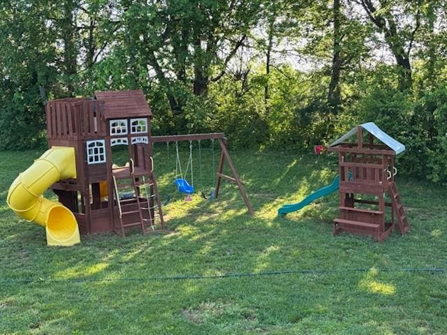 view of playground with a lawn