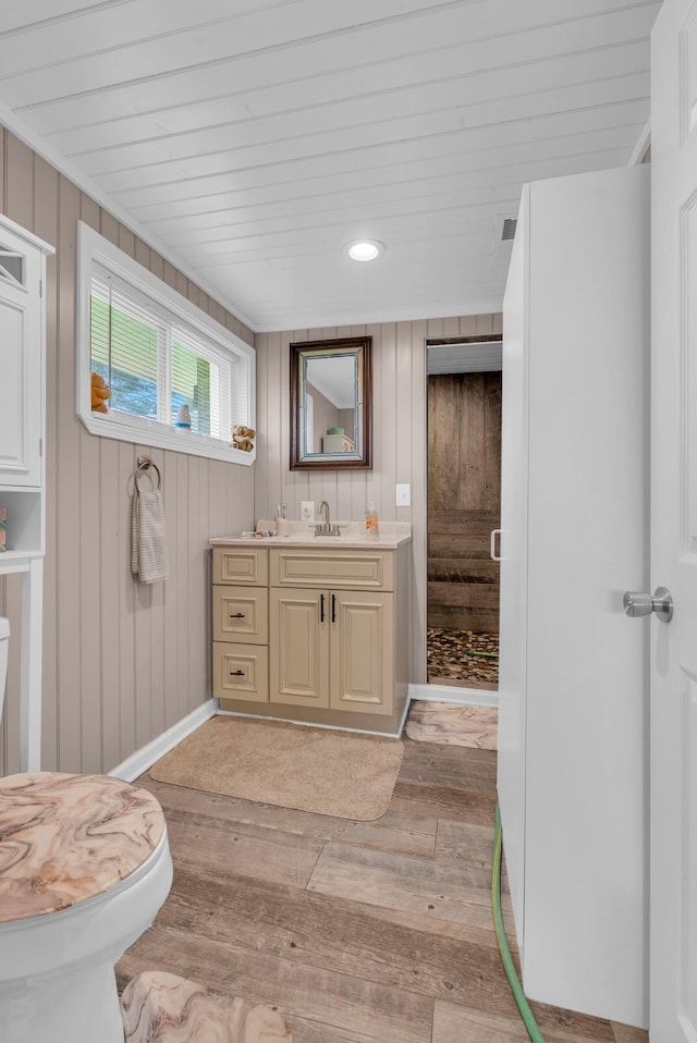 74 Farmer Rd, Crossville, TN 38571 - bathroom featuring recessed lighting, vanity, baseboards, hardwood / wood-style floors, and a shower with door