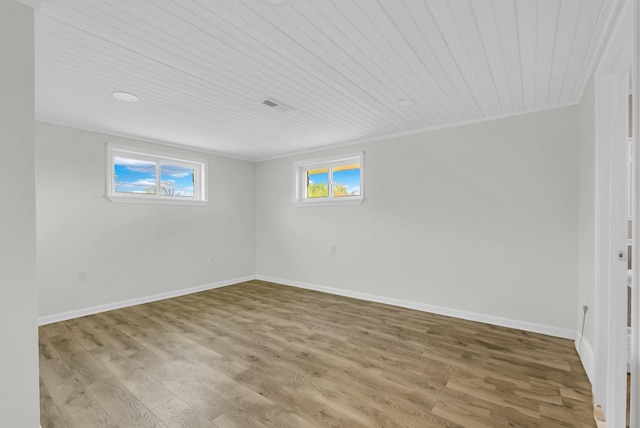 74 Farmer Rd, Crossville, TN 38571 - unfurnished room featuring wood finished floors, wood ceiling, ornamental molding, baseboards, and visible vents