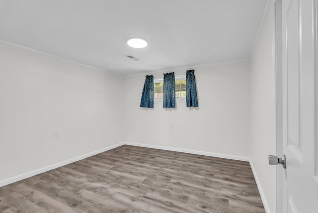 74 Farmer Rd, Crossville, TN 38571 - spare room with ornamental molding, visible vents, wood finished floors, and baseboards