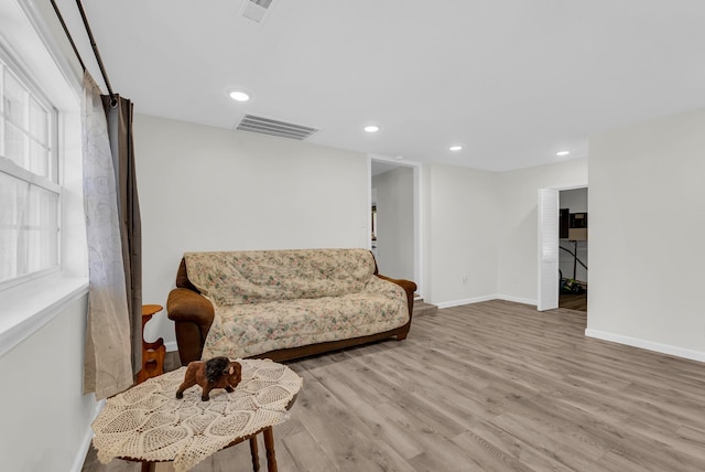 74 Farmer Rd, Crossville, TN 38571 - living area with recessed lighting, visible vents, wood finished floors, and baseboards