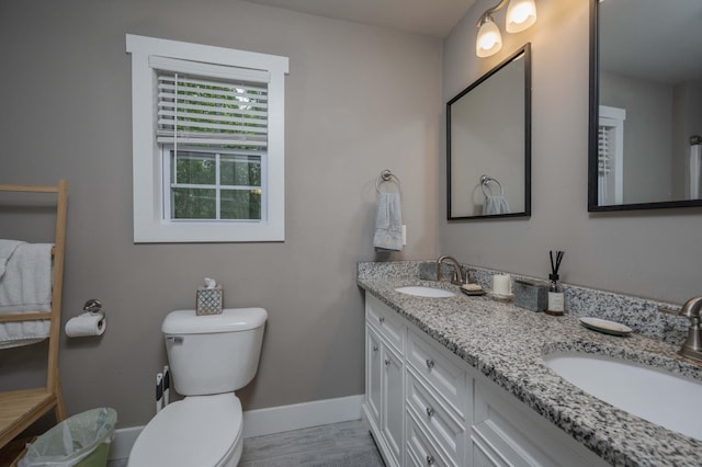 675 Hog Back Ridge Rd, Bethpage, TN 37022 - full bathroom with double vanity and wood finished floors