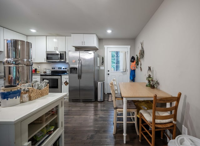 675 Hog Back Ridge Rd, Bethpage, TN 37022 - kitchen featuring appliances with stainless steel finishes, dark wood-type flooring, recessed lighting, white cabinetry, and light countertops