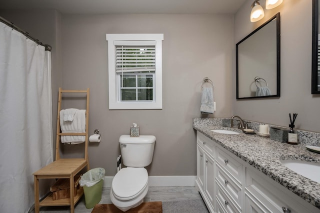 675 Hog Back Ridge Rd, Bethpage, TN 37022 - full bathroom with double vanity and wood finished floors