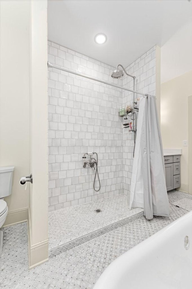 153 Lewis Rd, Morrison, TN 37357 - full bathroom featuring a tile shower, toilet, recessed lighting, and baseboards