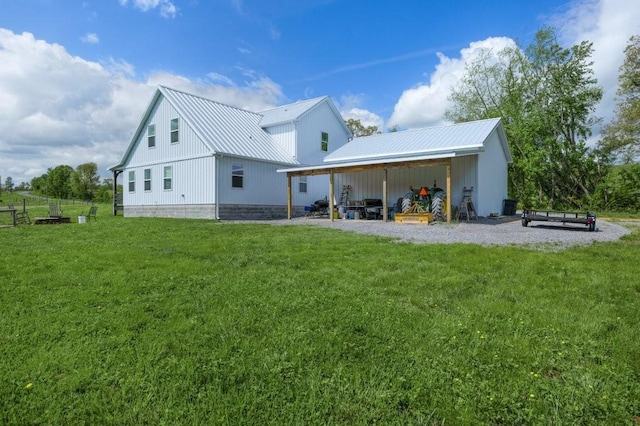 153 Lewis Rd, Morrison, TN 37357 - rear view of house with a carport, a yard, board and batten siding, and metal roof