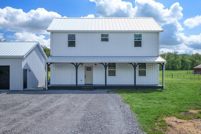 153 Lewis Rd, Morrison, TN 37357 - view of front of house featuring a porch, a front lawn, metal roof, an outbuilding, and gravel driveway