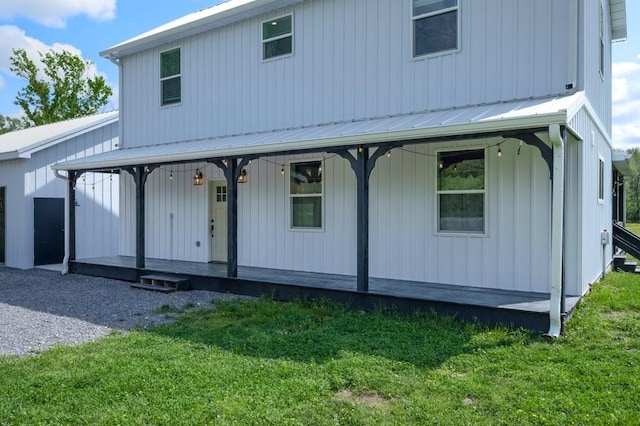 153 Lewis Rd, Morrison, TN 37357 - view of front facade featuring metal roof, a porch, and a front lawn