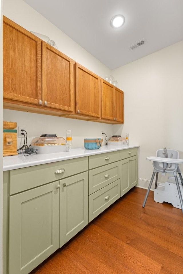 153 Lewis Rd, Morrison, TN 37357 - kitchen featuring visible vents, light countertops, green cabinetry, and dark wood-style floors