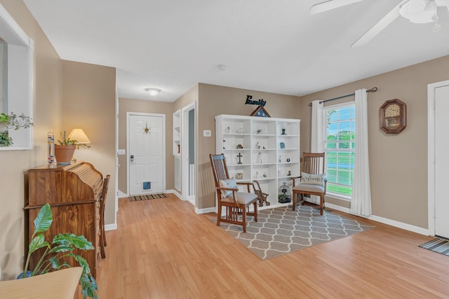 1368 Jason Cir, Ashland City, TN 37015 - living area with light wood-type flooring, a ceiling fan, and baseboards