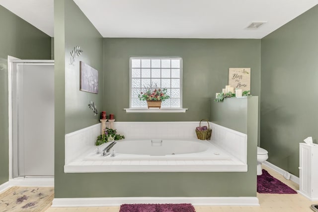 1368 Jason Cir, Ashland City, TN 37015 - bathroom featuring visible vents, a stall shower, baseboards, toilet, and a garden tub