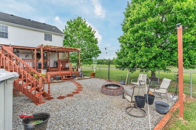 1368 Jason Cir, Ashland City, TN 37015 - exterior space featuring a pergola, a wooden deck, a fenced backyard, and an outdoor fire pit