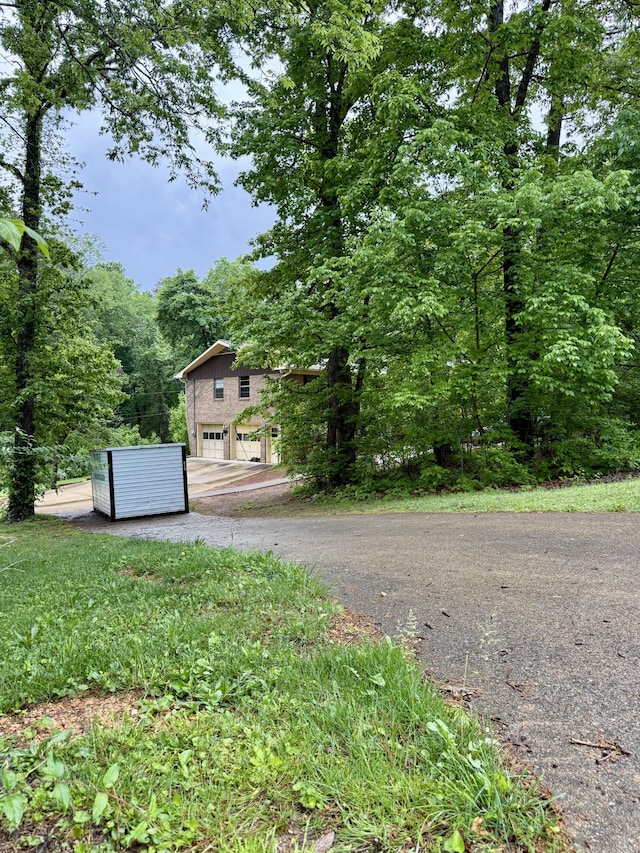 view of street featuring aphalt driveway