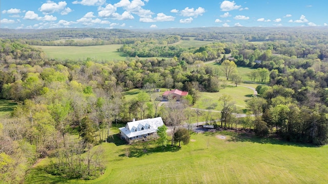aerial view featuring a rural view and a view of trees