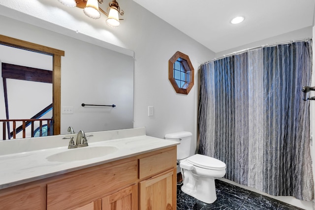 bathroom with curtained shower, marble finish floor, toilet, and vanity