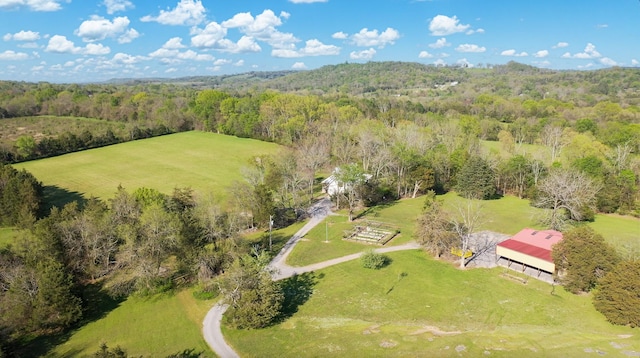 drone / aerial view with a rural view and a forest view