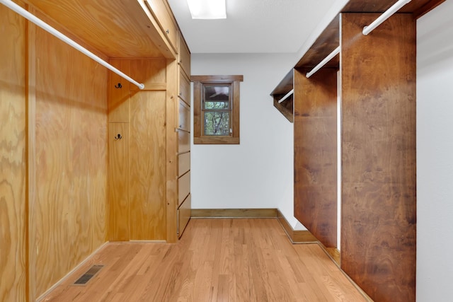 walk in closet featuring visible vents and light wood-style flooring