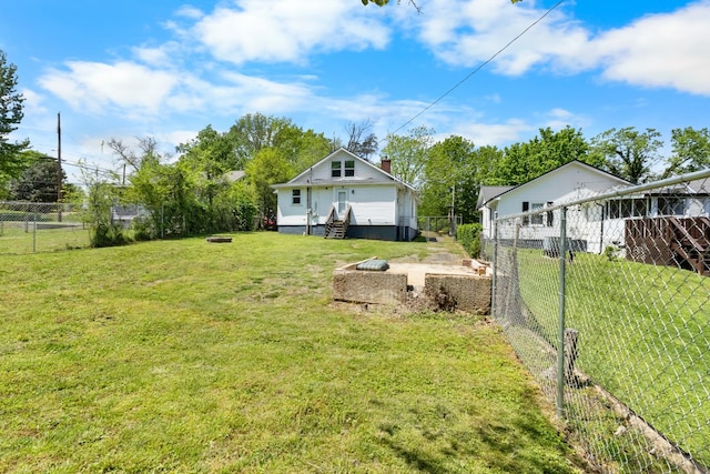 view of yard with a fenced backyard